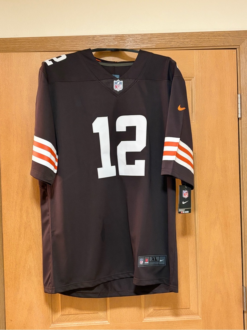 NFL Men’s Black #12 Football Jersey with White Numbers and Orange Stripes